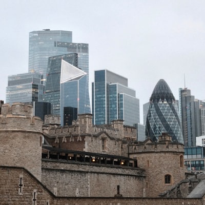 Ancient fortress contrasts with a modern city skyline