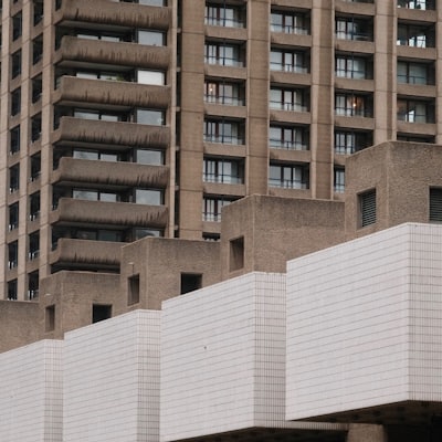Brutalist concrete buildings with white balconies and green plants